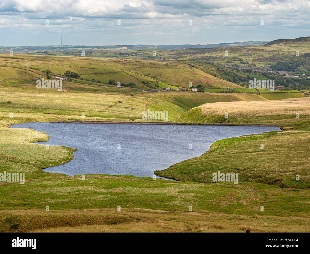 March Haigh Reservoir, looking towards Marsden with the Emley Moor transmitter in the distance. Huddersfield. UK Stock Photo