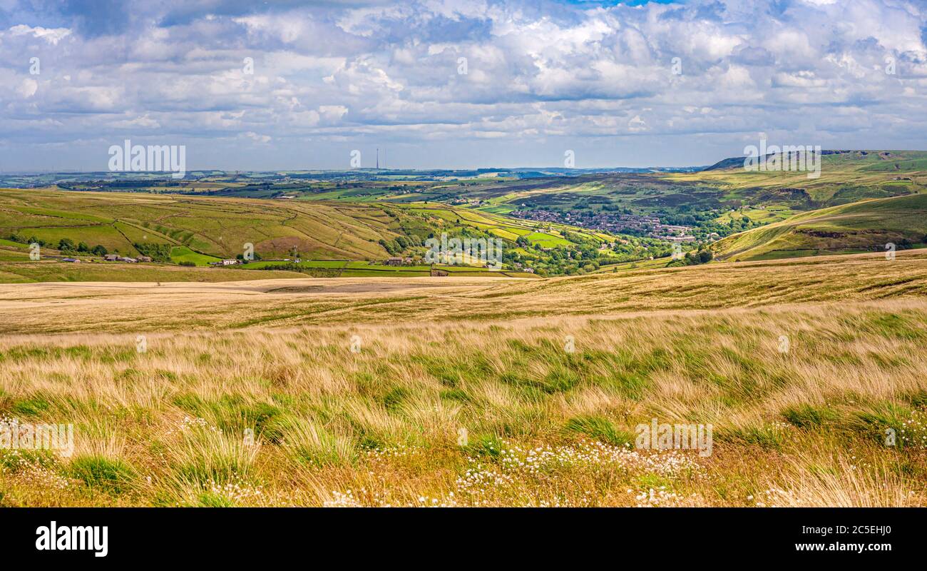 Dan Clough Moss looking toward the village of Marsden with Emley Moor Transmitting Station in the distance. Stock Photo