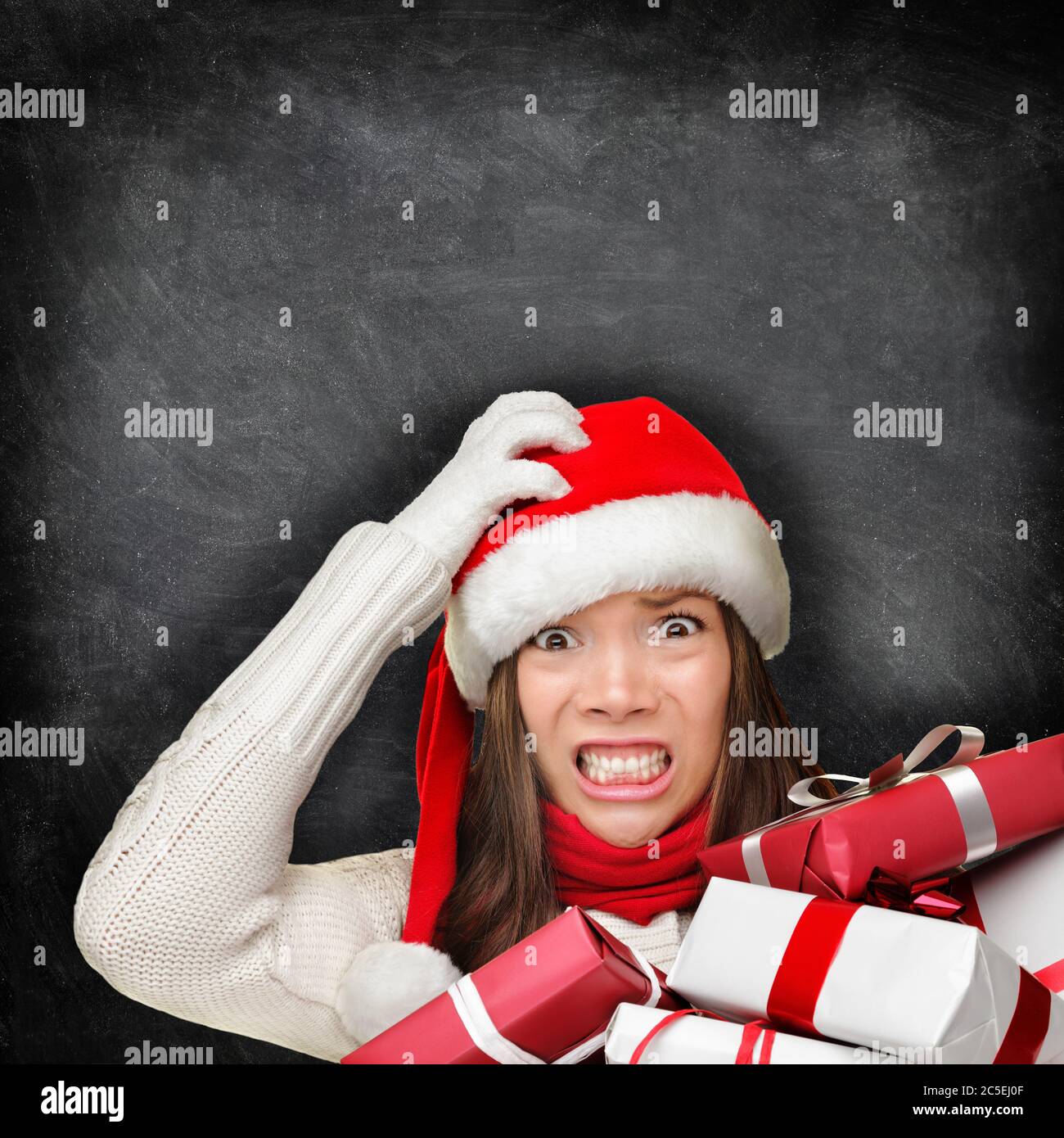 Christmas holiday stress - stressed gift woman Stock Photo