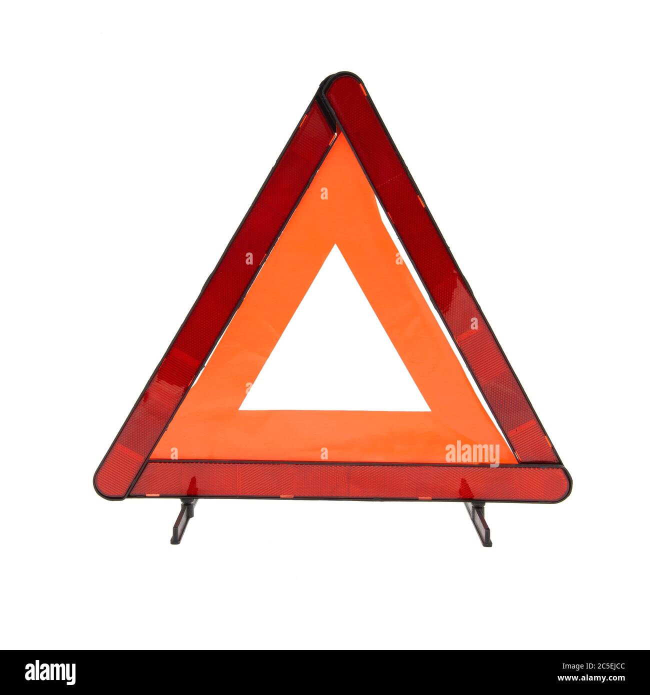 Emergency reflective car warning triangle used to warn others of a broken down vehicle, a legal requirement in most European countries, isolated on a Stock Photo