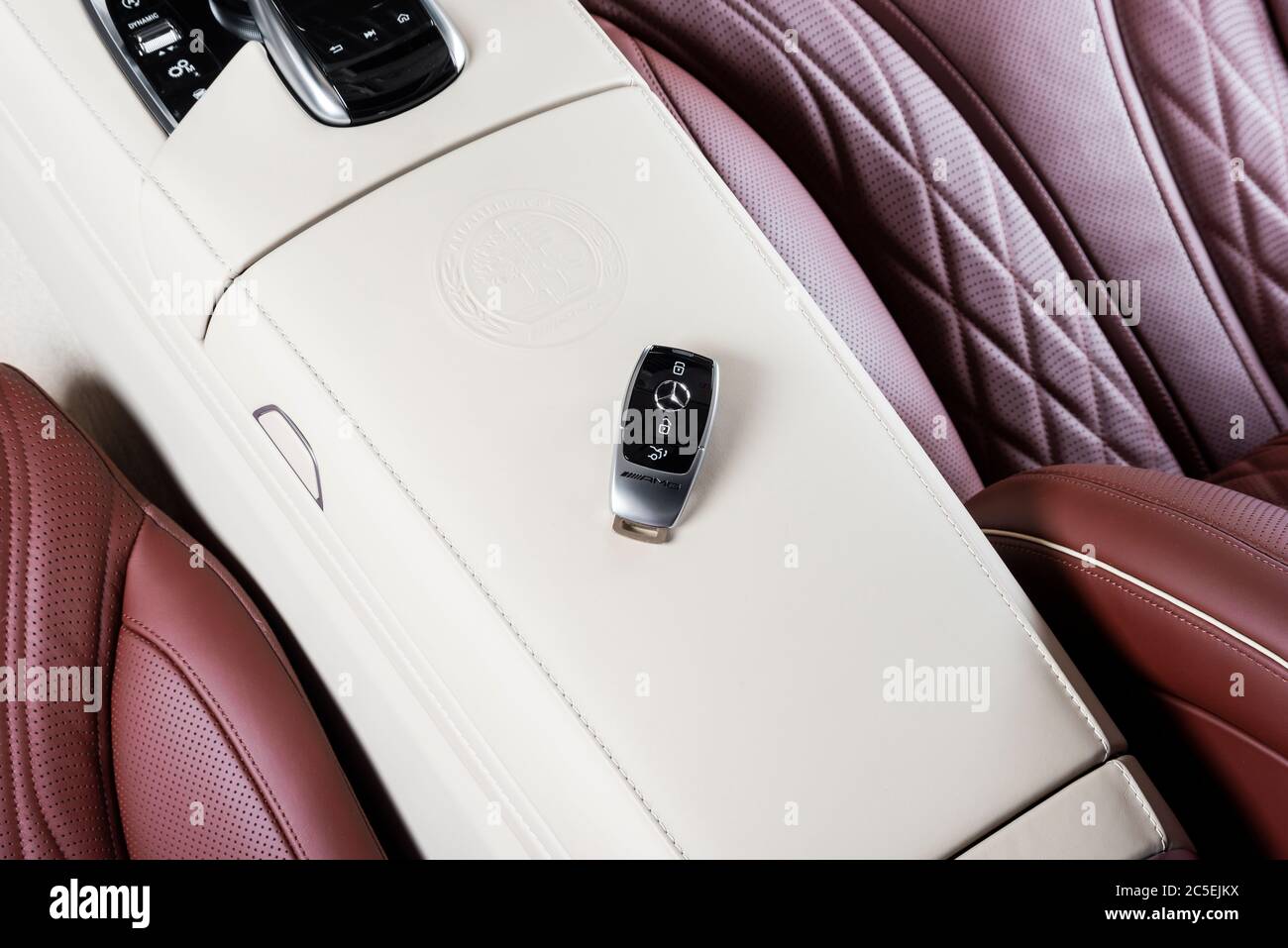 Sankt-Petersburg, Russia, January 12, 2018: Close up of key of Mercedes Benz AmG in red perforated leather interior, on the car seat Stock Photo