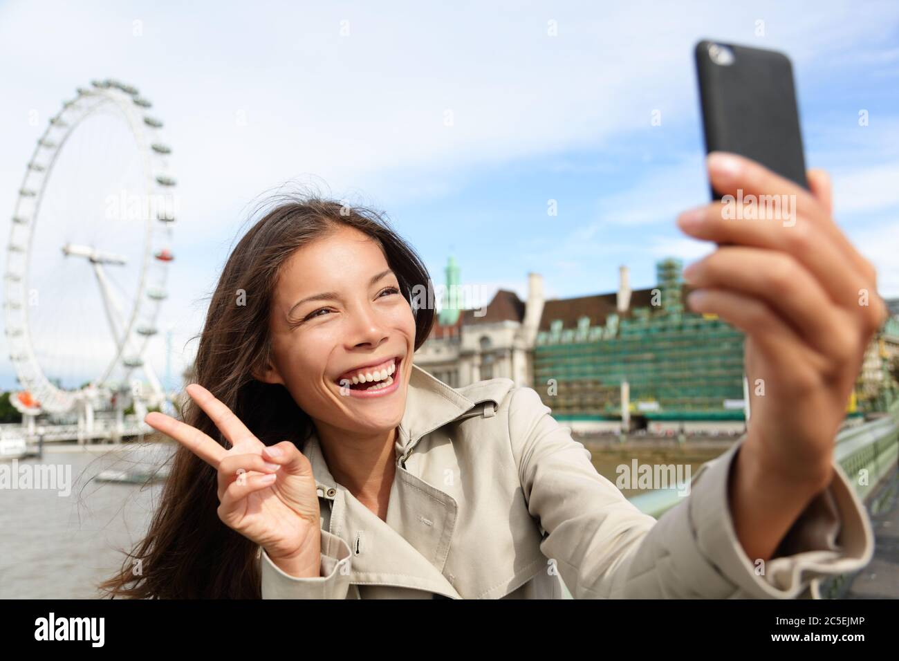 Asian tourist in London taking self-portrait photo Stock Photo