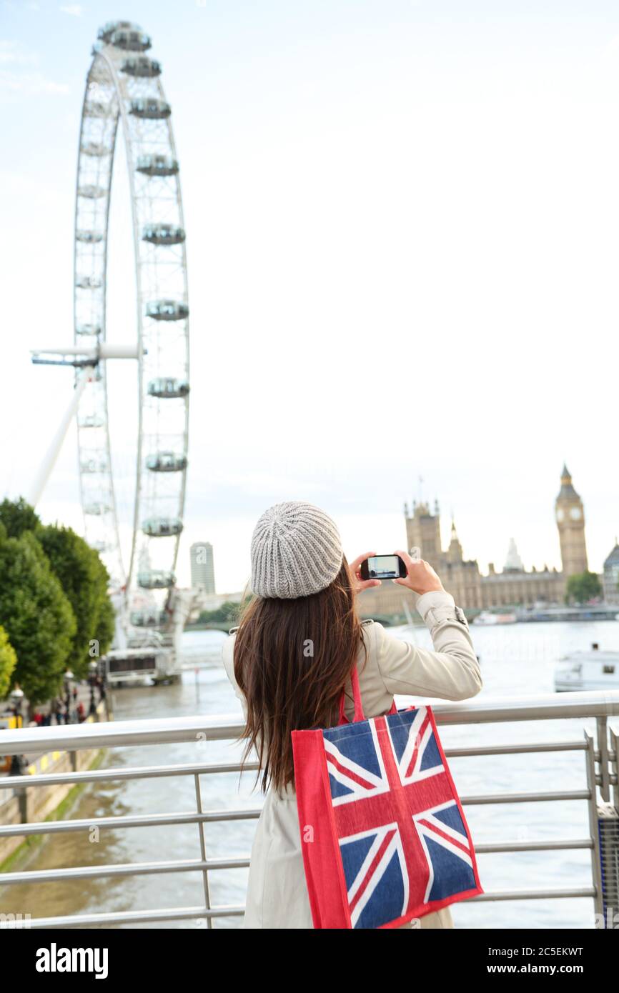 London Tourist taking picture of river Thames Stock Photo