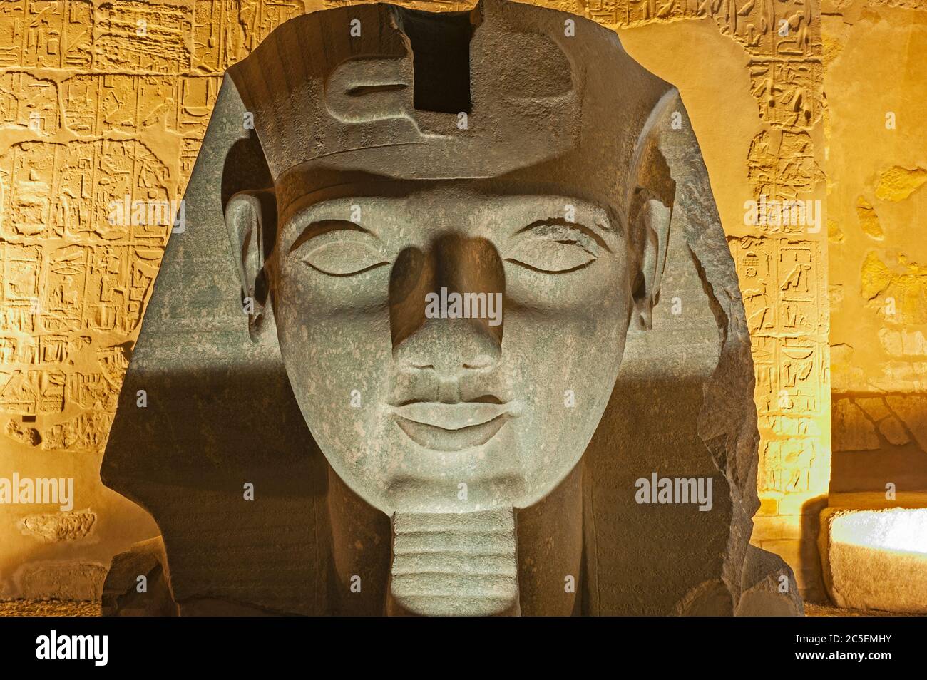 Large statue head of Ramses II at entrance to ancient egyptian Luxor ...
