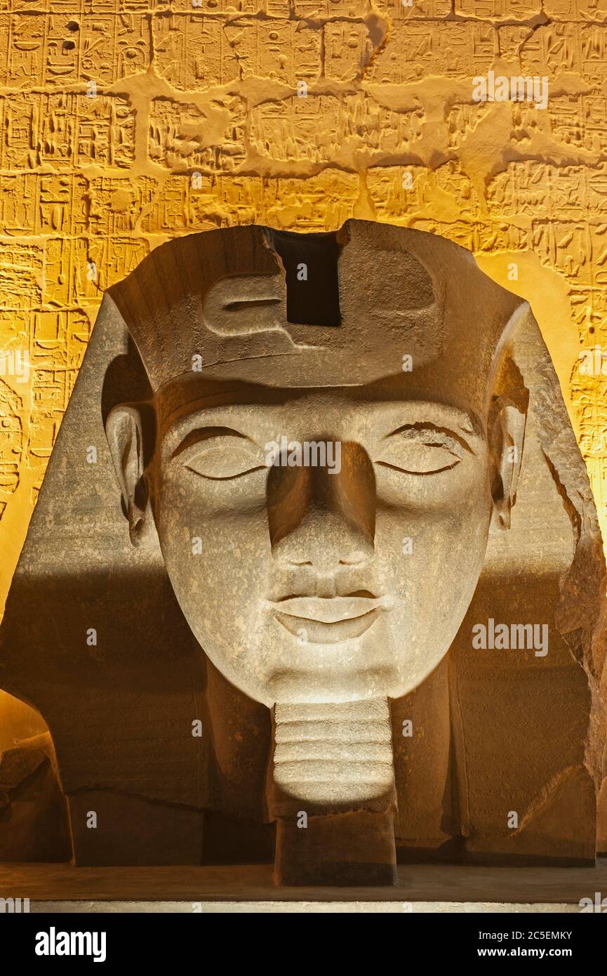 Large statue head of Ramses II at entrance to ancient egyptian Luxor ...