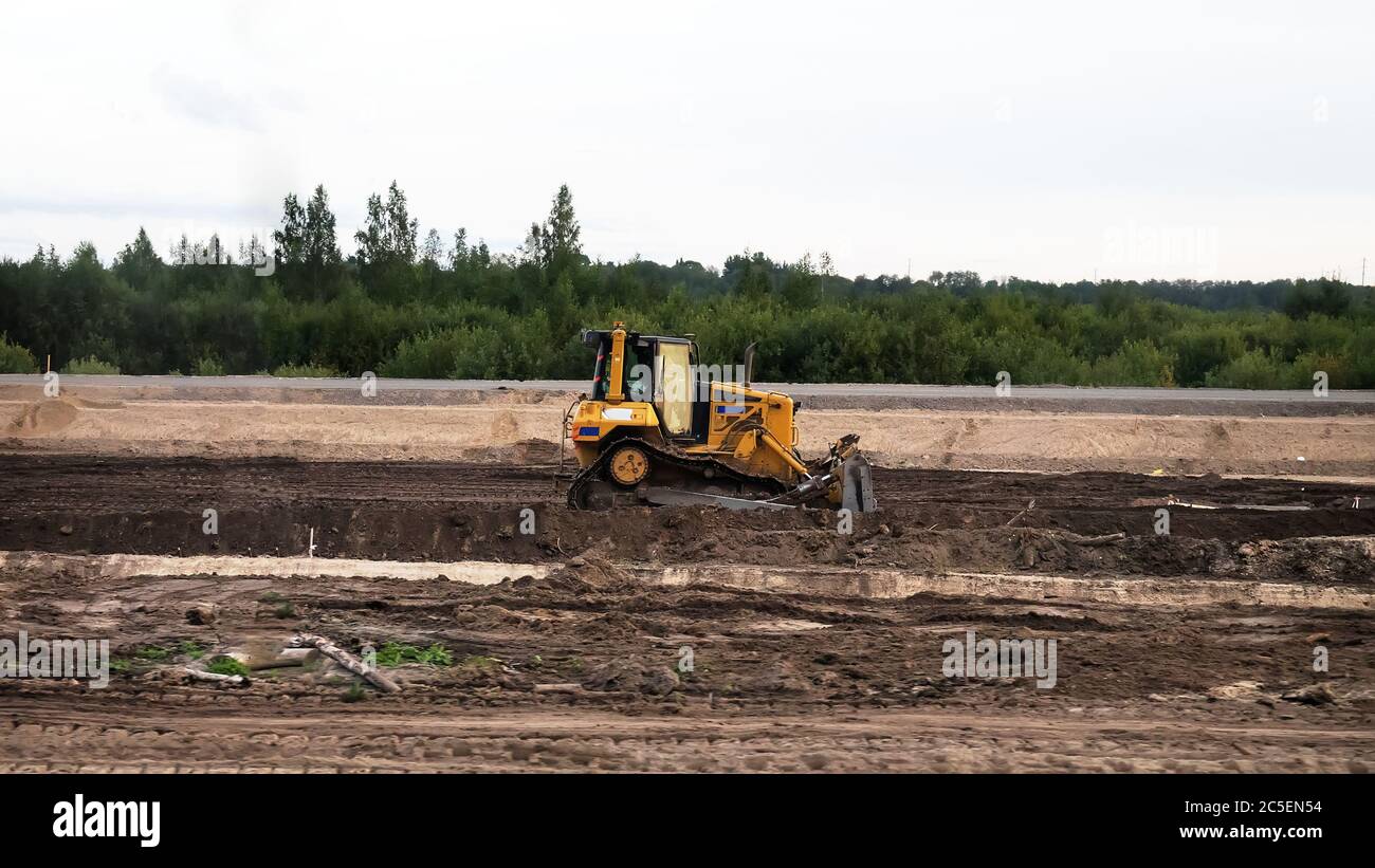 Road-building. Bulldozer, excavator and dump truck operation Stock Photo