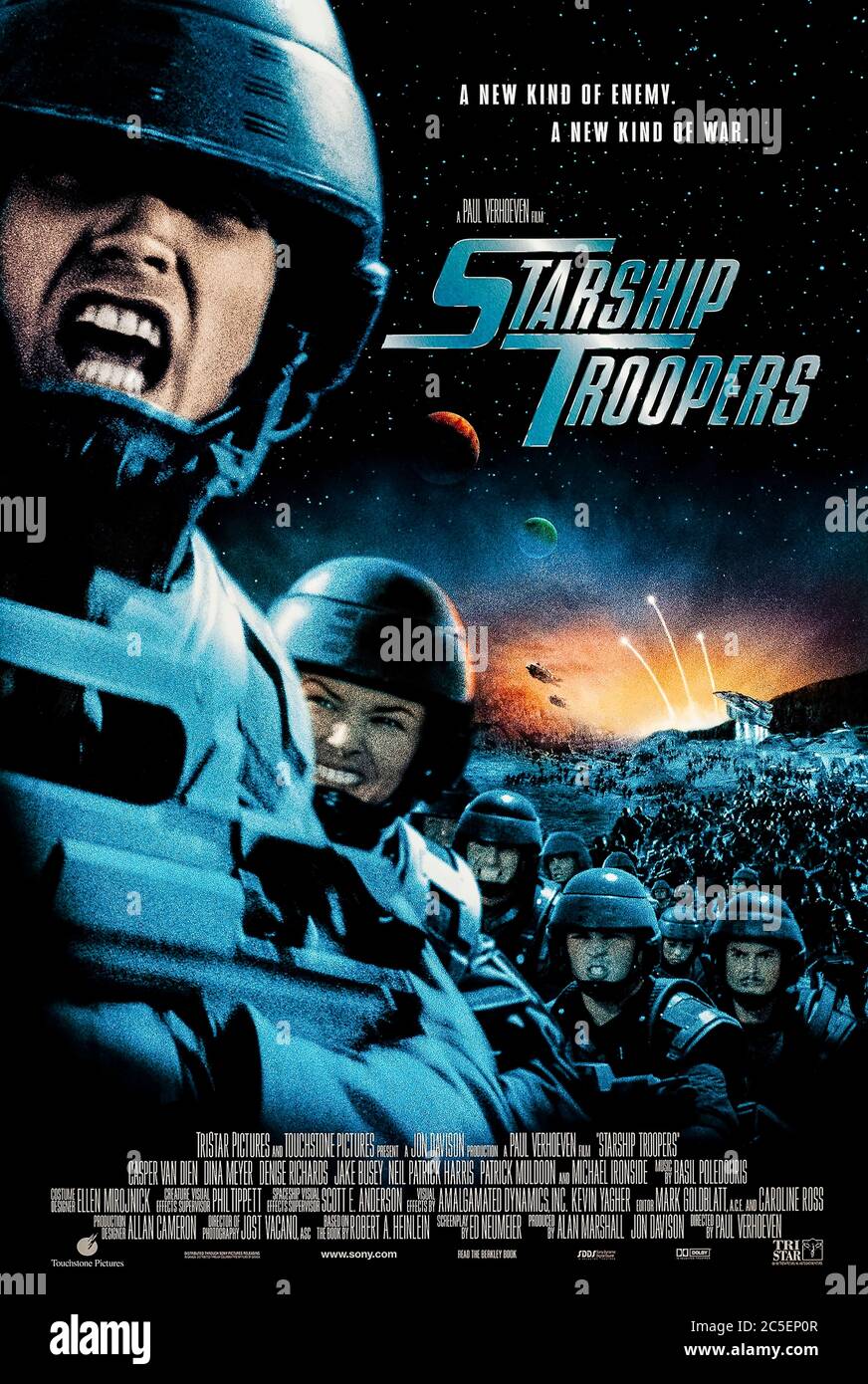 Starship Troopers (1997) directed by Paul Verhoeven and starring Casper Van Dien, Denise Richards, Dina Meyer and Neil Patrick Harris. No holds barred adaptation of Robert A. Heinlein's novel about a future militaristic and fascist human federation at war with giant alien insects bought to you by the writers and director of Robocop. Stock Photo