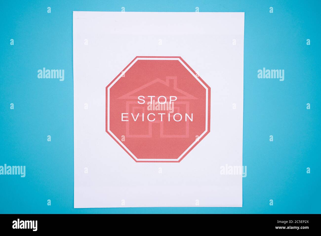 Concept of Tenants Stop Eviction signage printed on grunge textured paper. Stock Photo