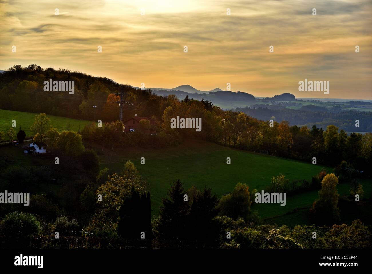 Looking down at a Swabian Alb Landscape with Colorful Autumn Trees, at The Horizon you can see Hill Hohenstaufen and Hill Rechberg, Germany, Europe Stock Photo