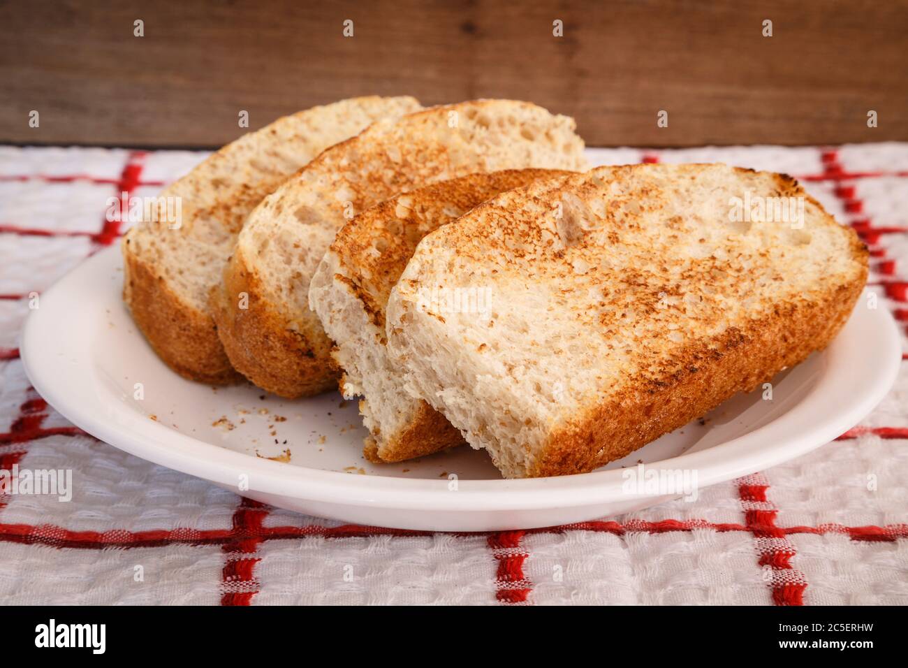 Homemade toast, sliced vienna bread in plate, ready to eat. Made with common flour and whole