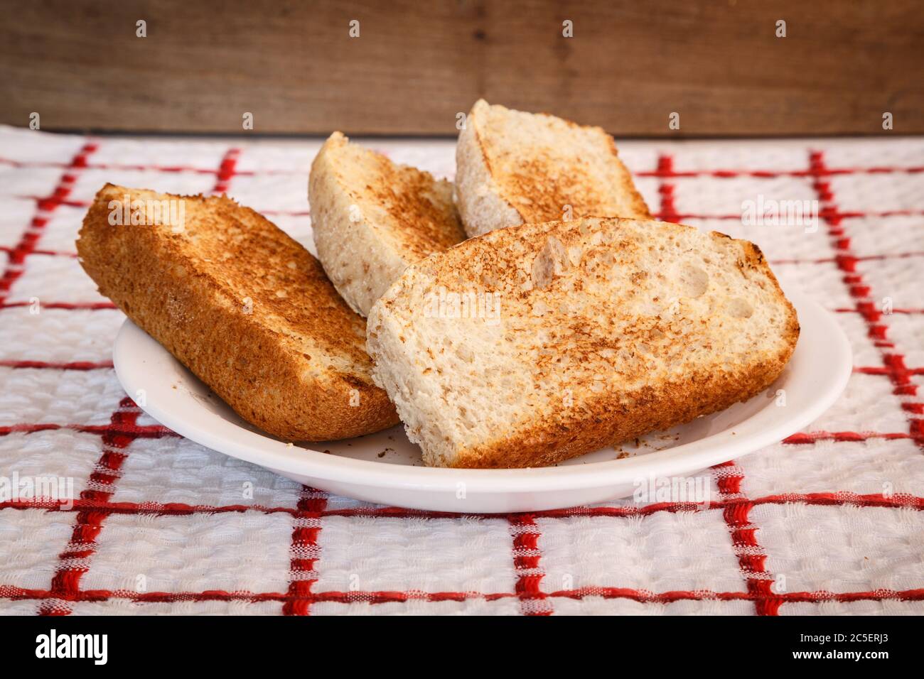 Homemade toast, sliced vienna bread in plate, ready to eat. Made with