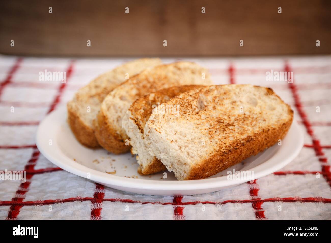 Homemade toast, sliced vienna bread in plate, ready to eat. Made with