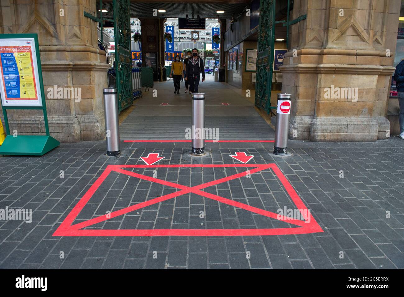 Glasgow, Scotland, UK. 2nd July, 2020. Pictured: Gordon Street entrance to Central Station in Glasgow city centre. Hand sanitising stations and face masks are offered to all passengers entering the station. Face coverings are mandatory on all public transport in Scotland. Today Nicola Sturgeon announced mandatory face coverings to be worn in all shops from 10th July next week in a bid to completely stop the spread of coronavirus (COVID19). Credit: Colin Fisher/Alamy Live News Stock Photo