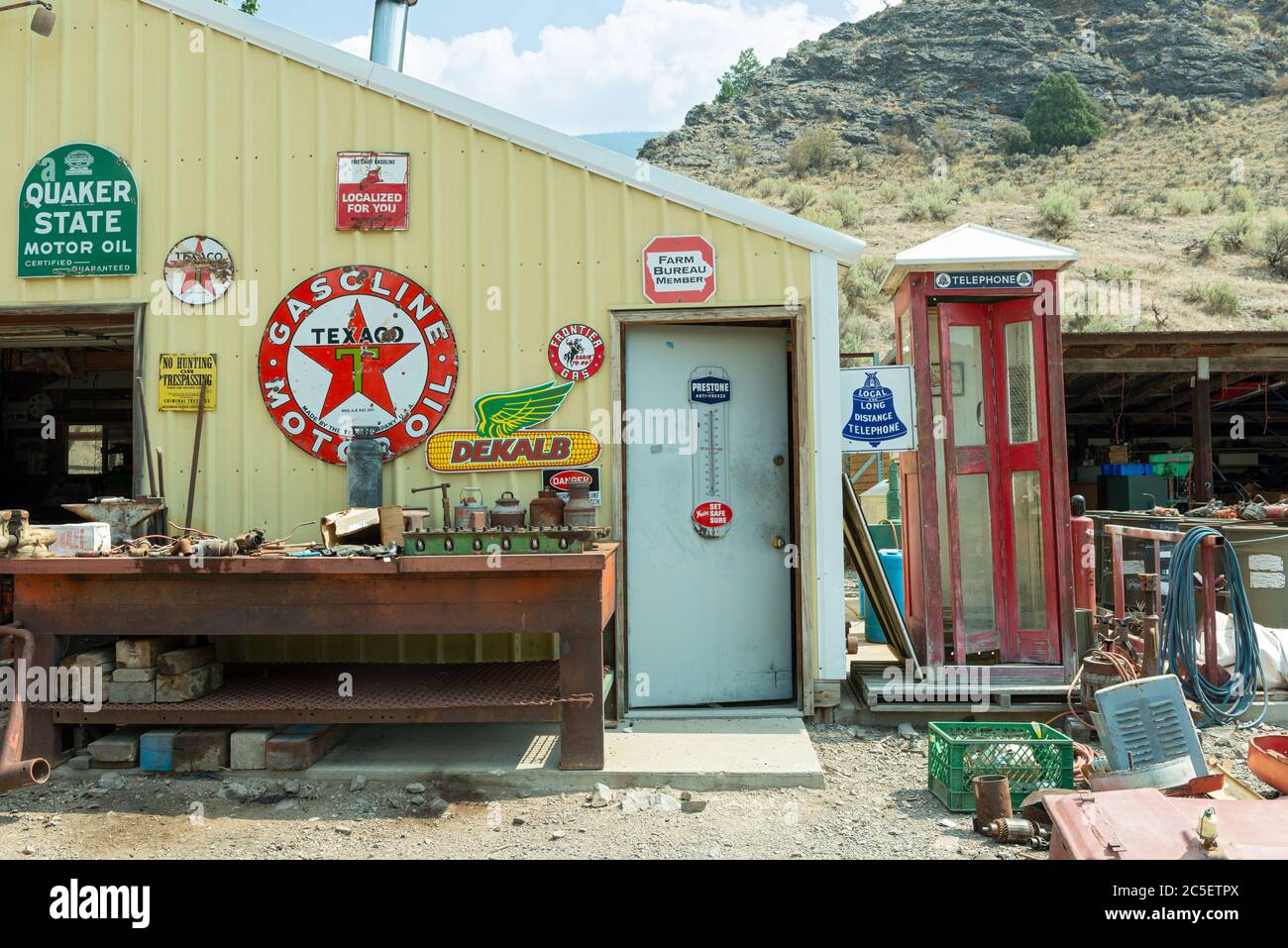 Idaho, USA - August 22, 2013: Outside of an old service station with an antique phone booth Stock Photo
