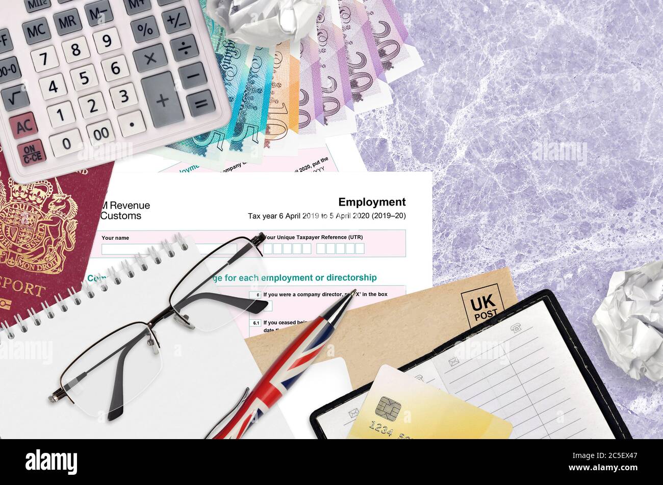 English Tax form sa102 Employment by HM revenue and customs lies on table  with office items. HMRC paperwork and tax paying process in United Kingdom  o Stock Photo - Alamy