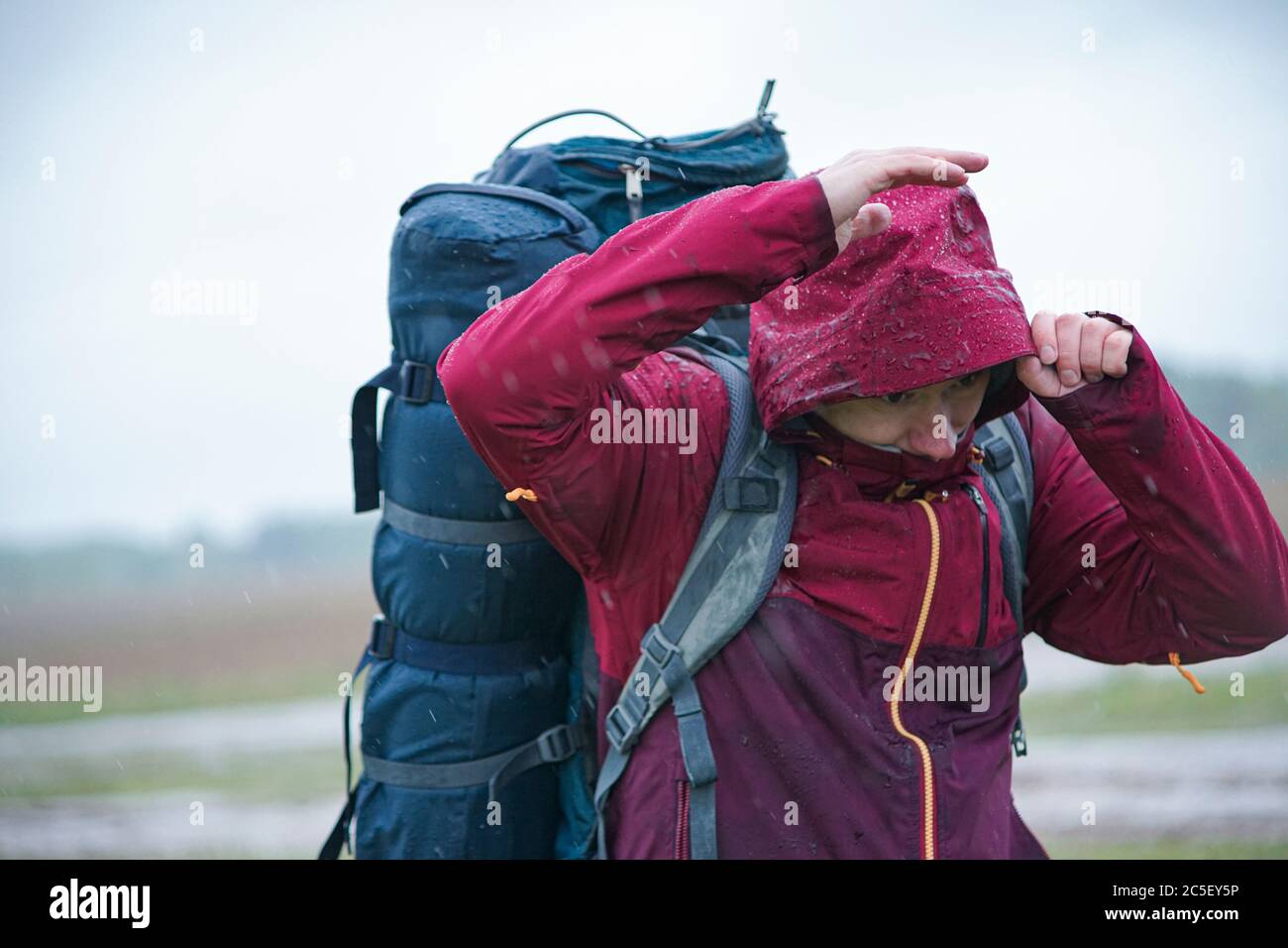 Person in rain coat storm hires stock photography and images Alamy