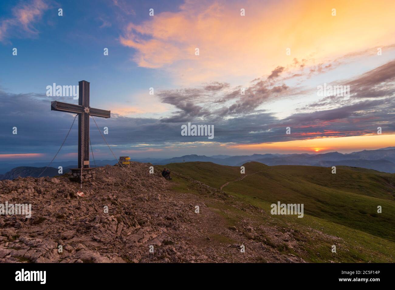 Sankt Barbara im Mürztal: mountain Hohe Veitsch (Veitschalpe), summit cross, sunrise in Hochsteiermark, Steiermark, Styria, Austria Stock Photo