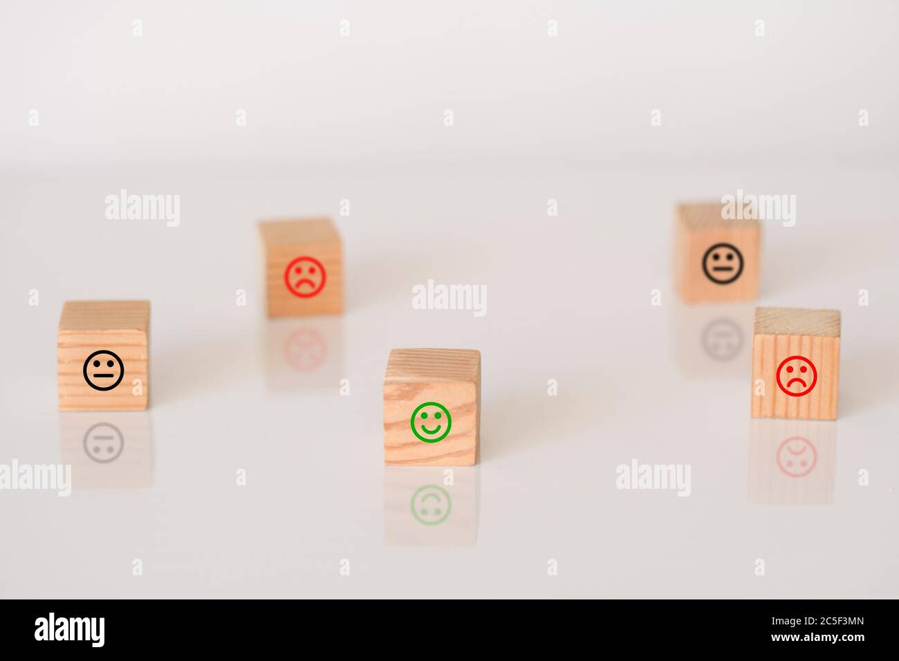 Wooden cubes with the image of smile face emotion. Customer survey ...