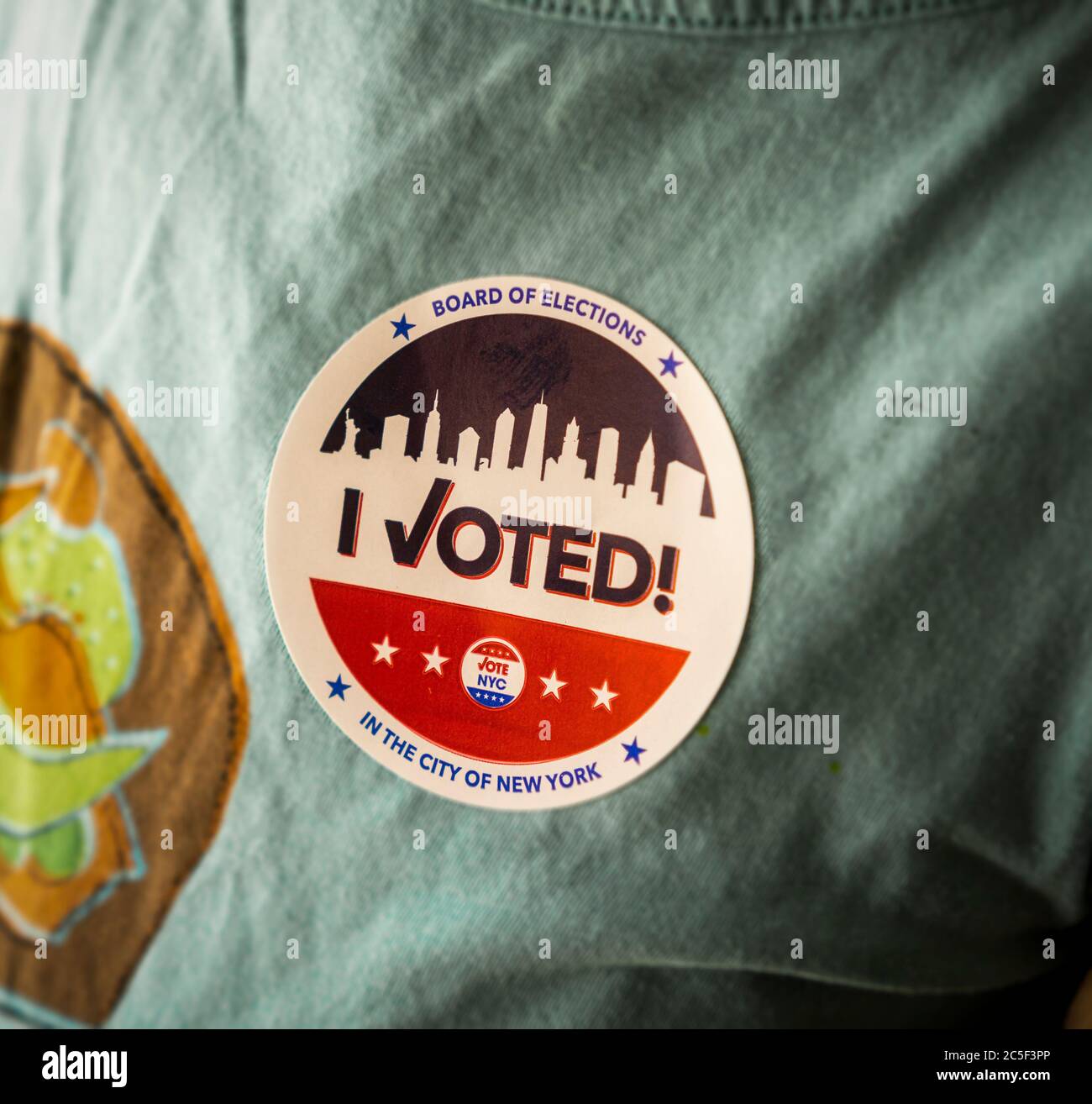A voter wears her 'I Voted' sticker on Primary Election Day in New York on Tuesday, June 23, 2020. (© Richard B. Levine) Stock Photo