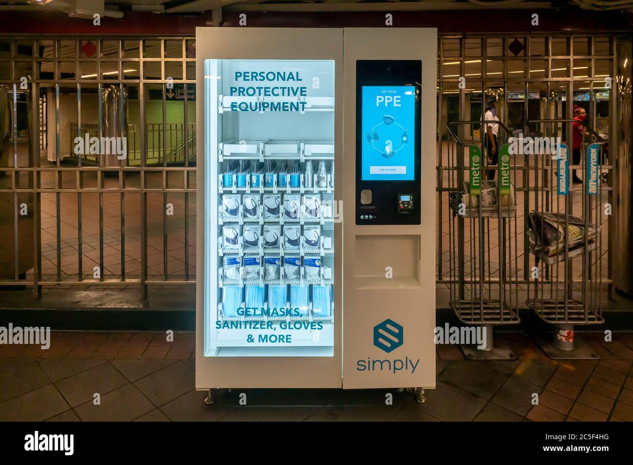 A vending machine in the Herald Square subway station in New York on Tuesday, June 30, 2020 sells PPE merchandise to riders. The MTA has placed twelve vending machines selling personal protective equipment and hand sanitizer in 10 major stations in the system. Masks are required to ride subways and busses. © Richard B. Levine) Stock Photo
