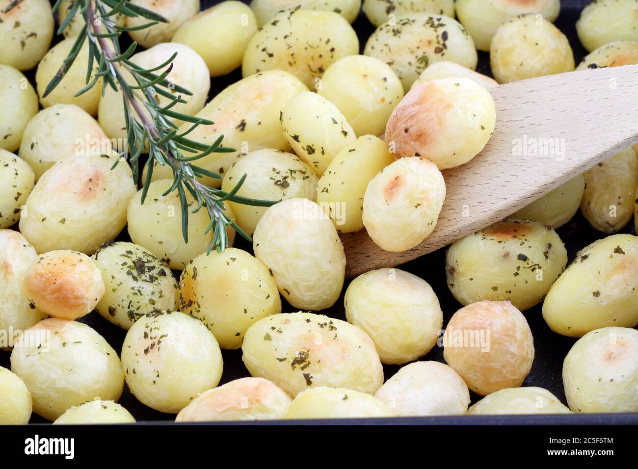 Roasted potatoes close up Stock Photo - Alamy