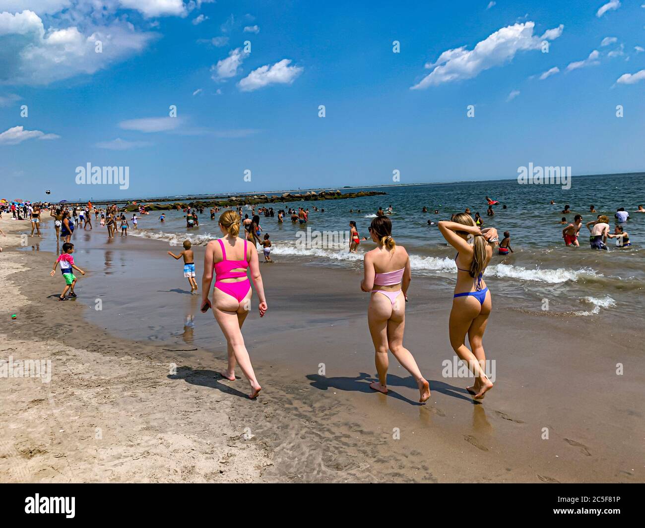 New York, New York, USA. 2nd July, 2020. NEW) Reopening of beaches in New York City. July 2, 2020, Coney Island, Brooklyn, New York, USA: Movement of people at Coney Island in Brooklyn . The beaches in New York were reopened yesterday (01) after lockdown because of the Covid-19 pandemic that struck the city. However, most of the people are not using masks. Credit: Niyi Fote /Thenews2. Credit: Niyi Fote/TheNEWS2/ZUMA Wire/Alamy Live News Stock Photo
