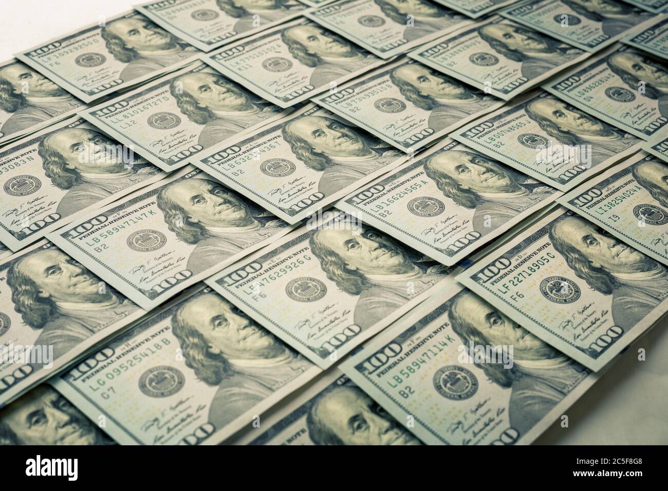Lot of one hundred dollar bills close-up background Stock Photo - Alamy
