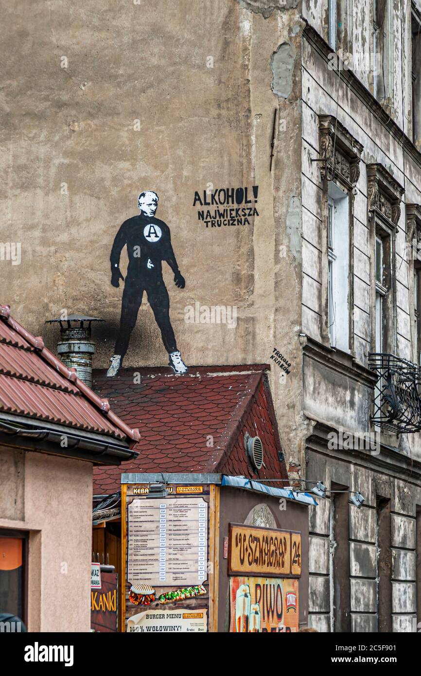 A graffito in Krakow warns: ALCOHOL! THE BIGGEST POISON. Kraków Impressions, Krakow, Poland Stock Photo