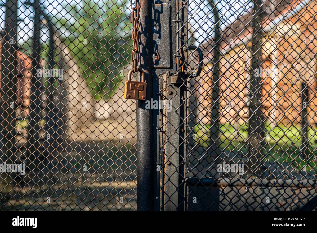 Electric and barbed wire fence in the Concentration Camp Auschwitz. Monument against genocide Stock Photo