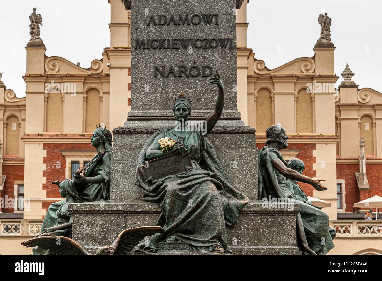 Monument to Adam Mickiewicz in front of the Kraków Cloth Halls (Sukiennice) in Krakow, Poland Stock Photo