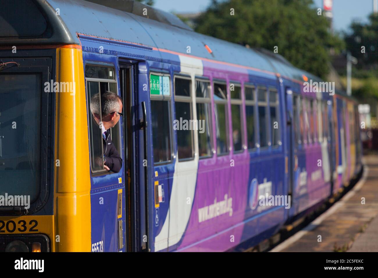 Northern Rail train driver looking out of a Northern Rail class 142 pacer train at Blackpool south railway station Stock Photo