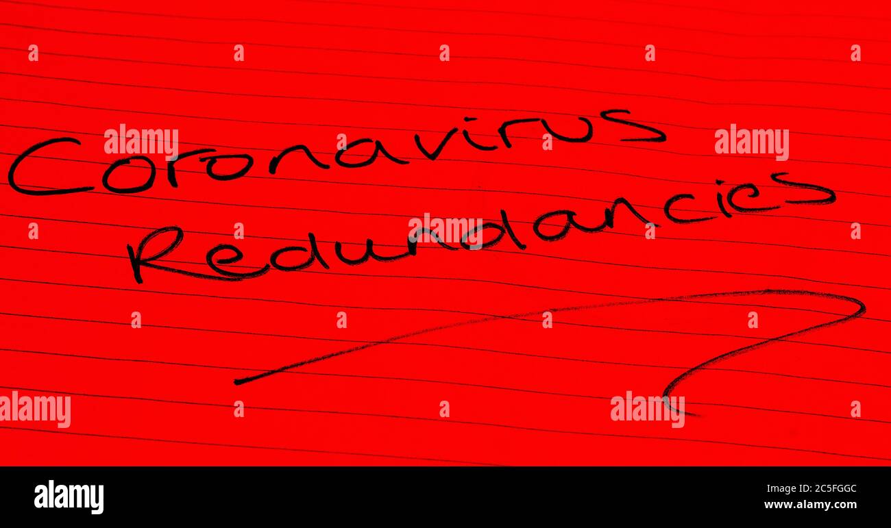 ‘Coronavirus redundancies’ written on lined paper Stock Photo