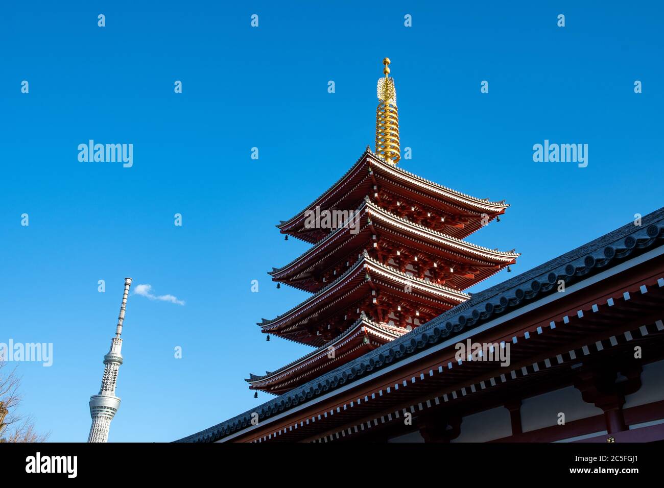 The five stories Pagoda of the Senso-ji temple and the Tokyo Skytree tower. Tokyo, Japan. Stock Photo