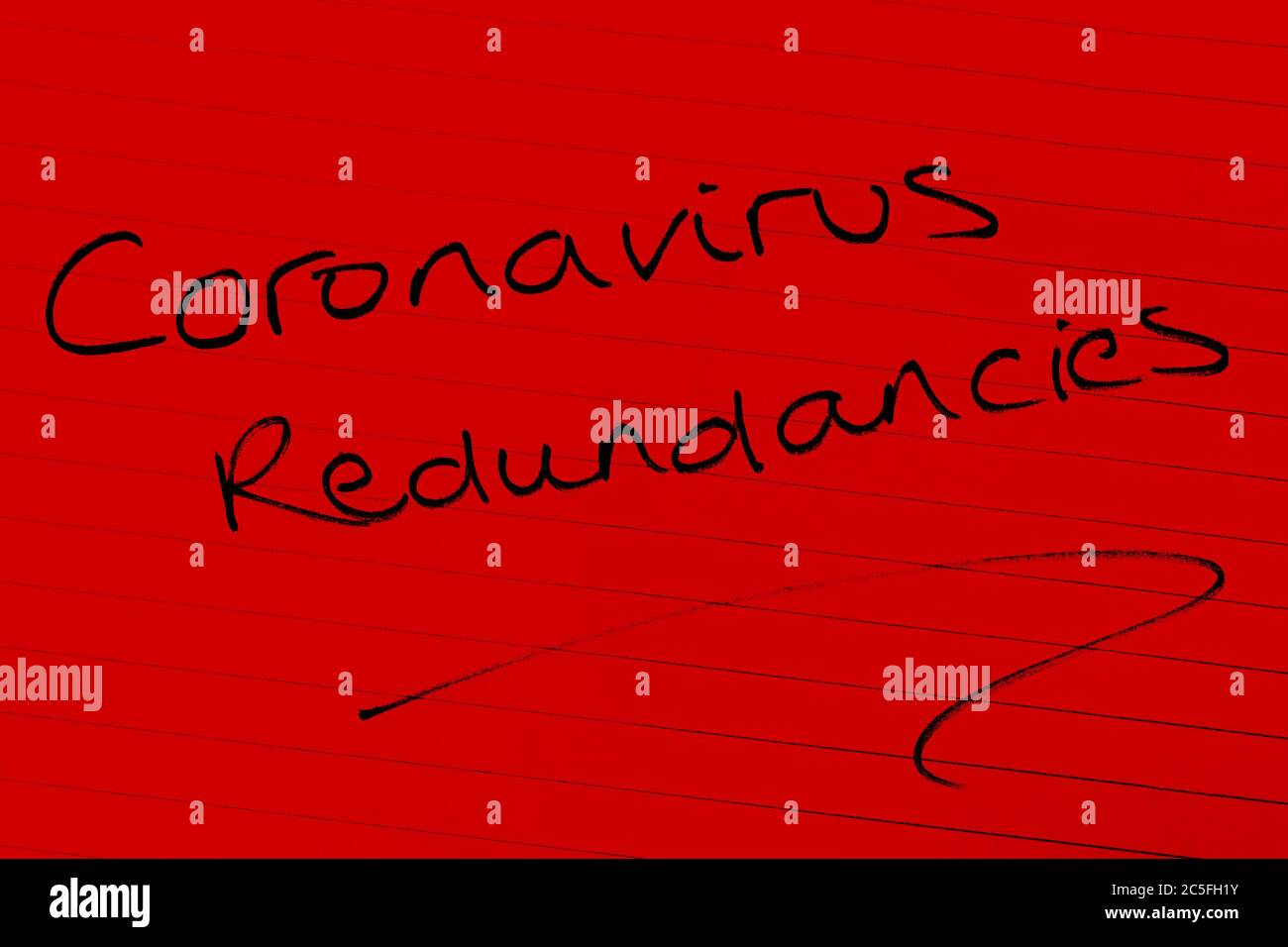 ‘Coronavirus redundancies’ written on lined paper Stock Photo