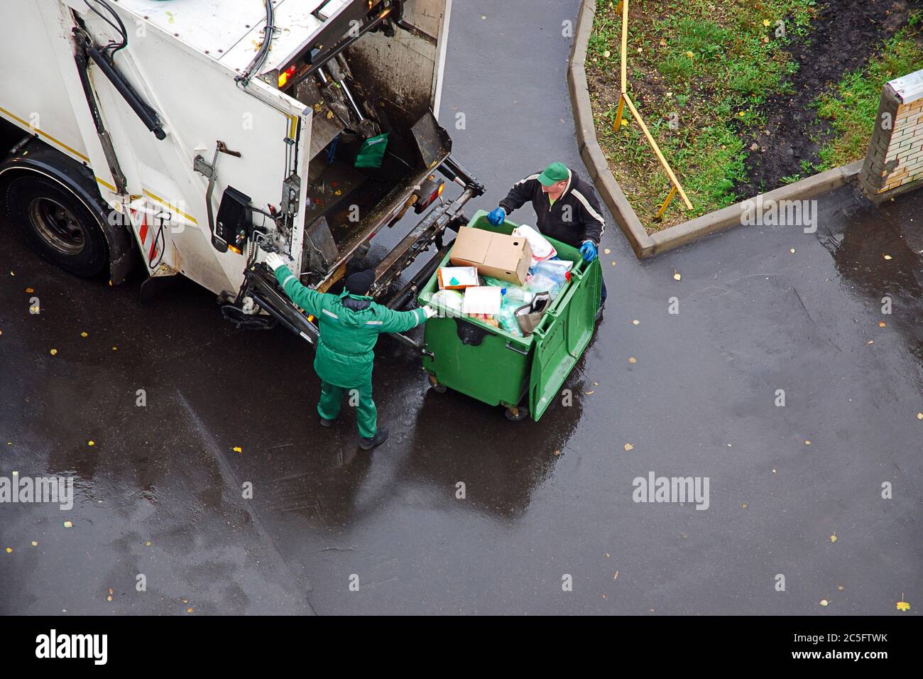 garbage removal in residential area, garbage men loading household