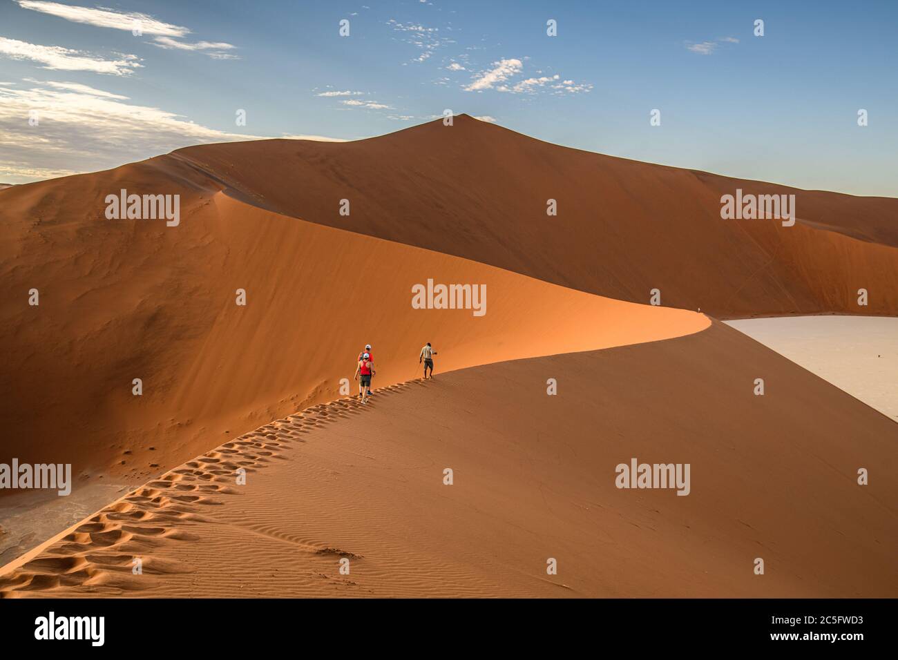 Hikers Climbing Sand Dunes in Sossusvlei , Namib-Naukluft National Park ...
