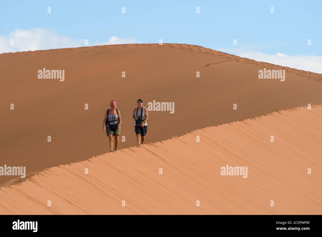 Hikers on a Sand Dune in Sossusvlei , Namib-Naukluft National Park ...