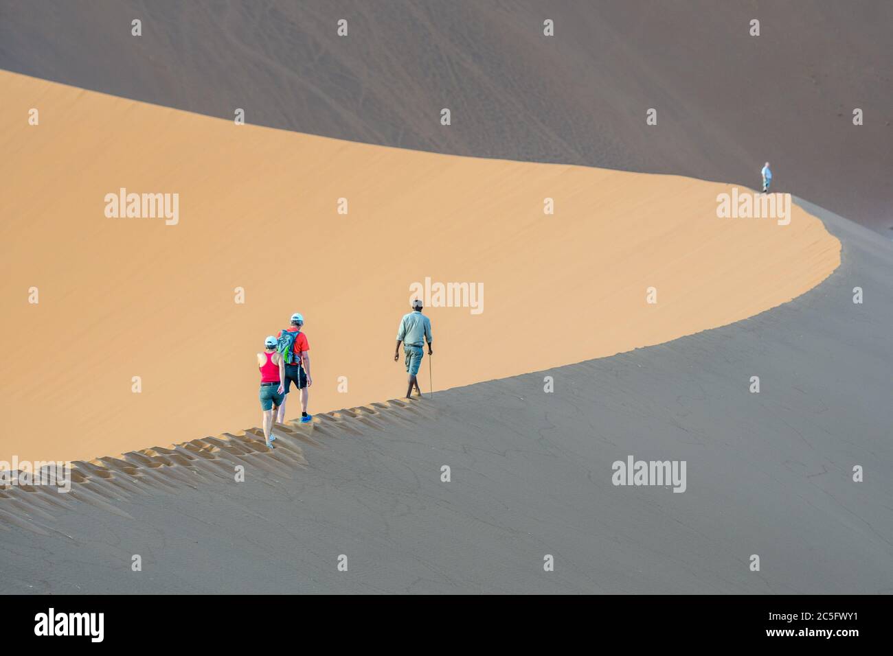 People Hiking a Sand Dune in Sossusvlei , Namib-Naukluft National Park ...