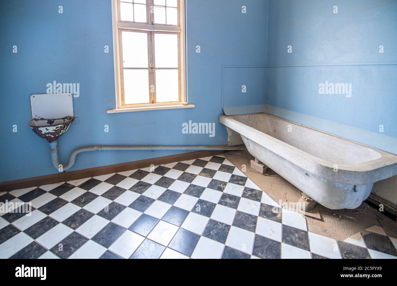 The interior of a building in the ghost town of Kolmanskop , Karas Region, Namibia Stock Photo