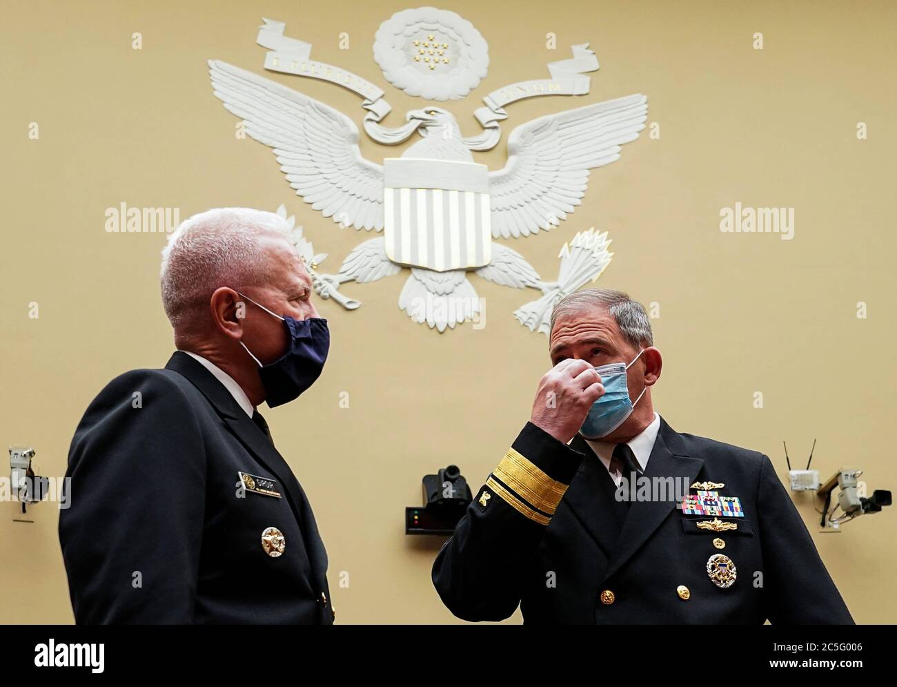Washington, United States Of America. 02nd July, 2020. Admiral Brett Giroir, United States Assistant Secretary for Health speaks with Rear Admiral John P. Polowczyk, Vice Director, J4, Joint Staff at the start of a House Select Subcommittee on the Coronavirus Crisis hearing on "The Administration Response to Ongoing Shortages of PPE and Critical Medical Supplies" on Capitol Hill in Washington, U.S., July 2, 2020. Credit: Kevin Lamarque/Pool via CNP | usage worldwide Credit: dpa/Alamy Live News Stock Photo