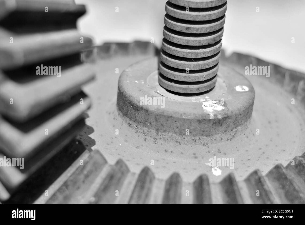 Screw and steel gears of an old mechanical device Stock Photo