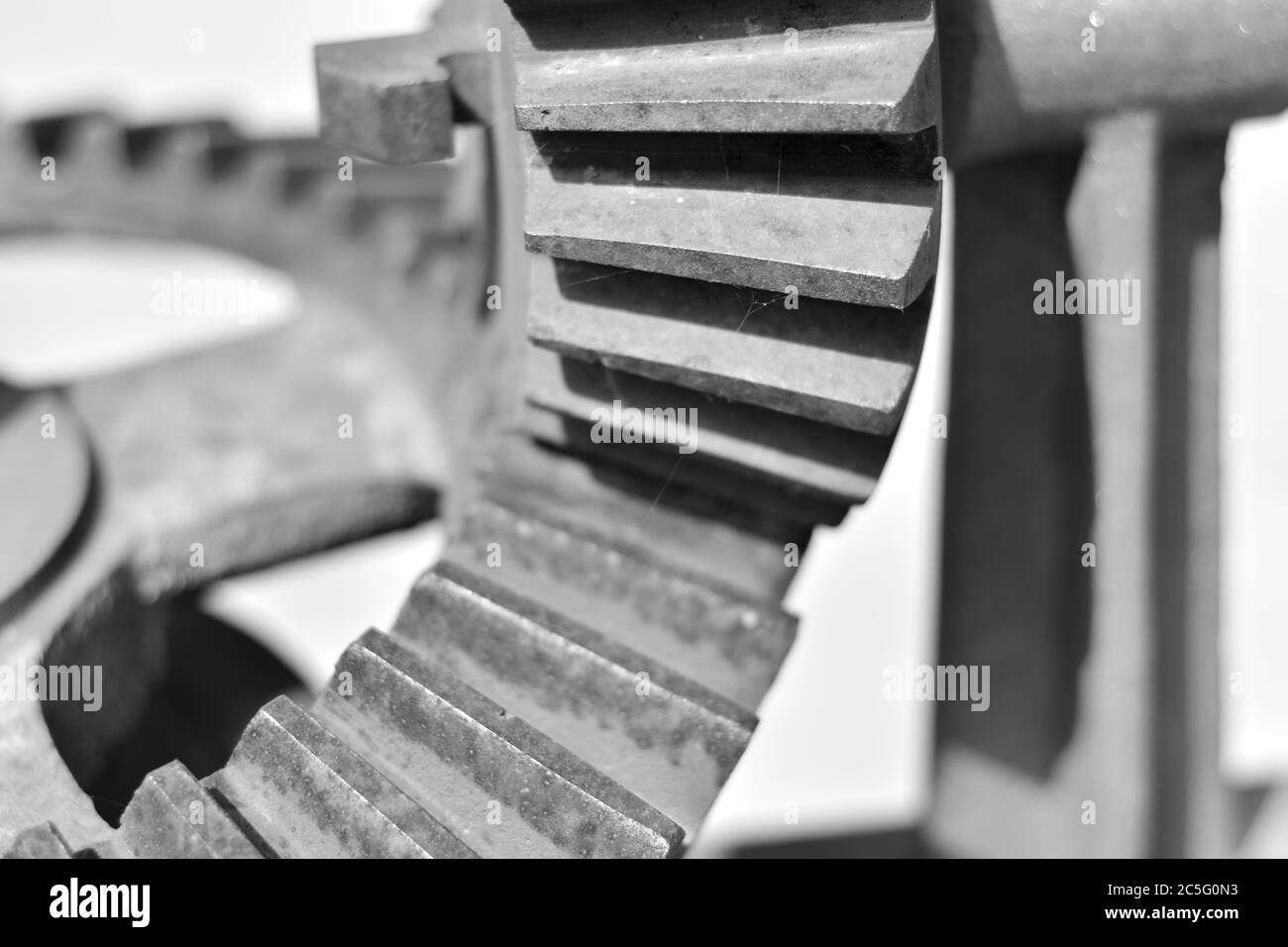 Screw and steel gears of an old mechanical device Stock Photo