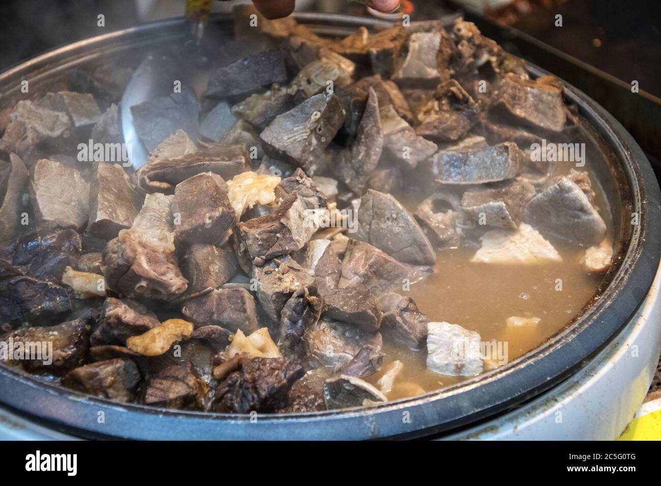 Beef offal stew sold at Kuromon market in Osaka city, Japan Stock Photo