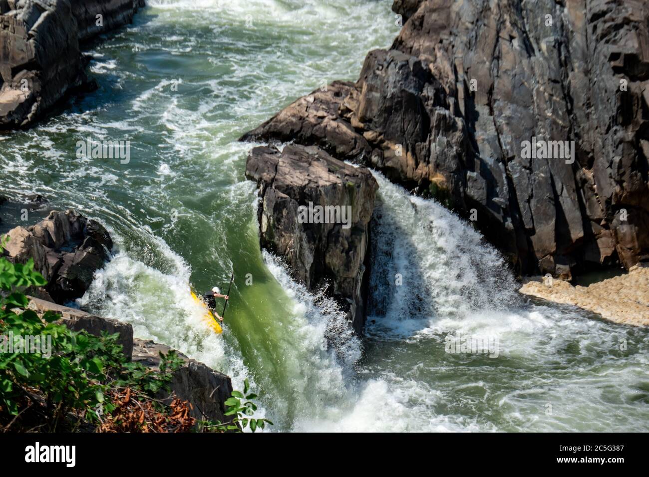 Brave river enthusiasts paddle their kayaks through the Potomac River