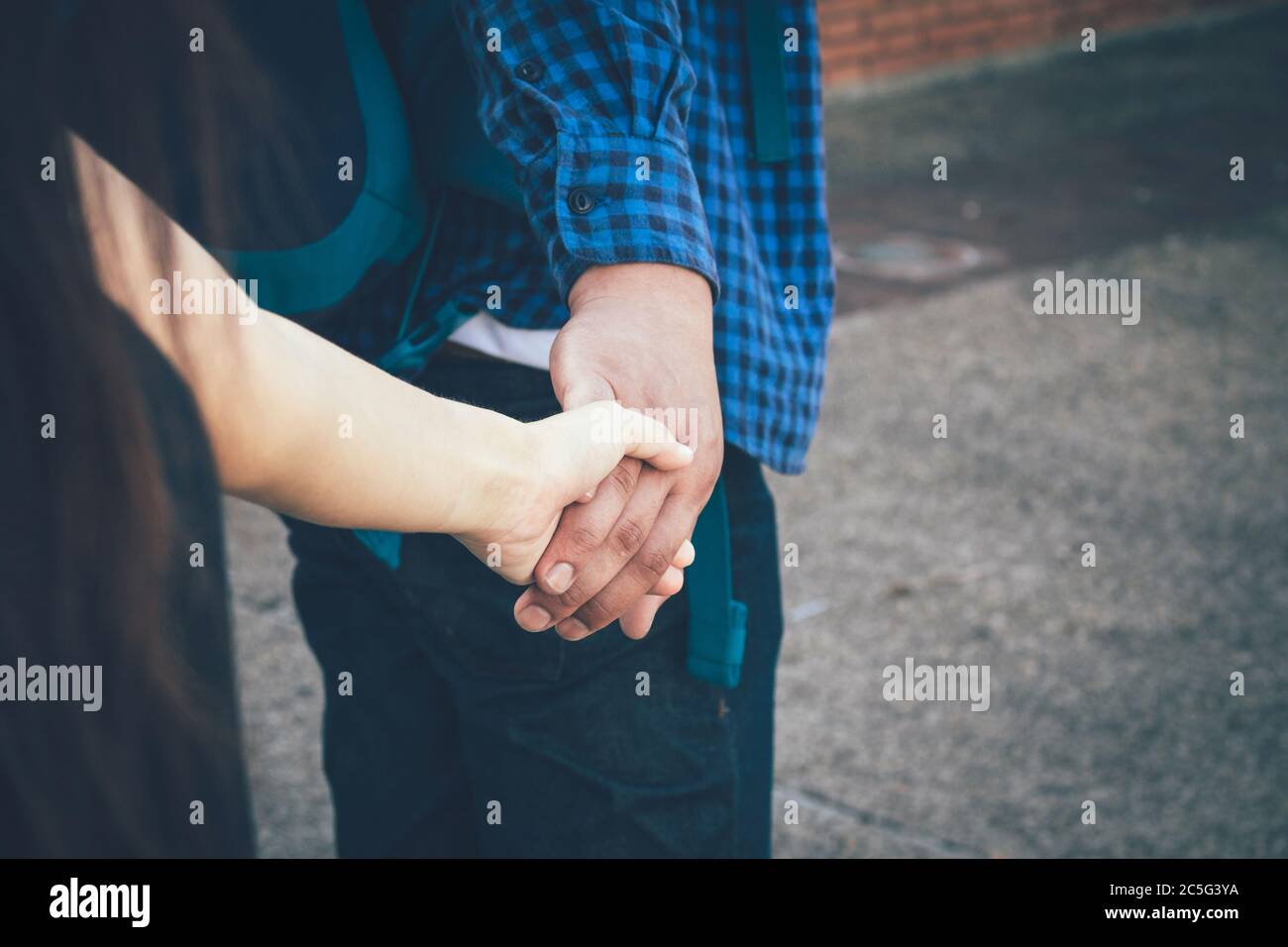 Teen couple walking holding hands hi-res stock photography and images ...