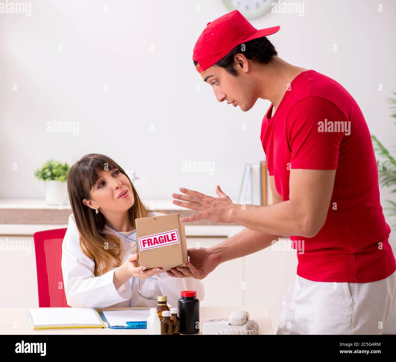 The courier delivering urgent parcel to the hospital Stock Photo Alamy