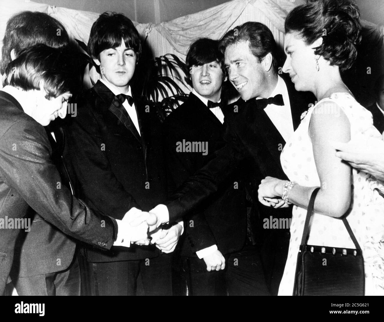 July 30, 1965 - London, England, United Kingdom - H.R.H. PRINCESS MARGARET, right, accompanied by her husband LORD SNOWDON, second from right, at the world premiere of THE BEATLES new film 'Help', which took place at the London Pavilion. Lord Snowdon shakes hands with RINGO STARR, left, as the Princess, PAUL McCARTNEY, second from left, JOHN LENNON, center, and The Beatles meet at the screening of the film.  (Credit Image: © Keystone Press Agency/Keystone USA via ZUMAPRESS.com) Stock Photo