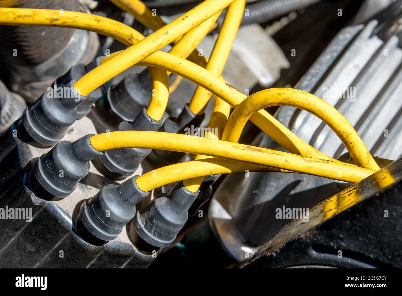 Distributor cap and high performance yellow ignition wires on a car
