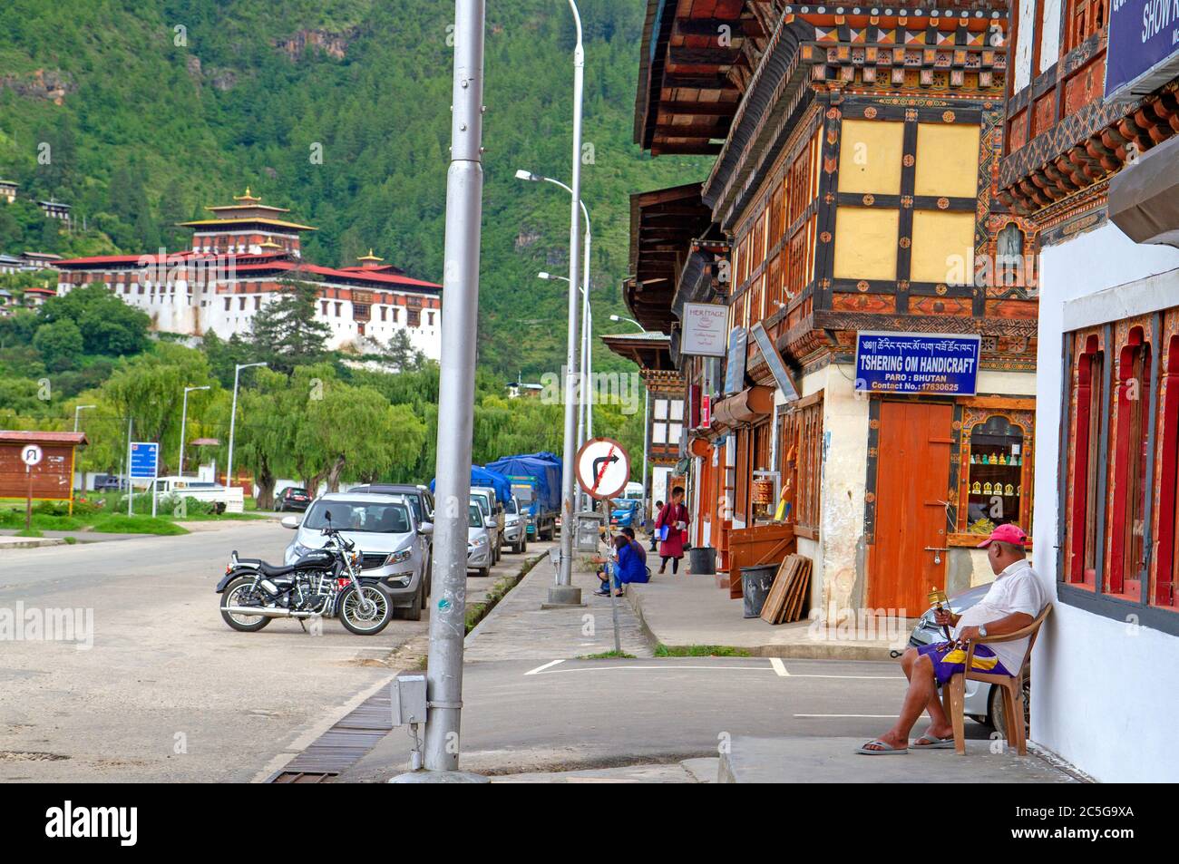 The main street of Paro, with Paro Dzong ahead Stock Photo