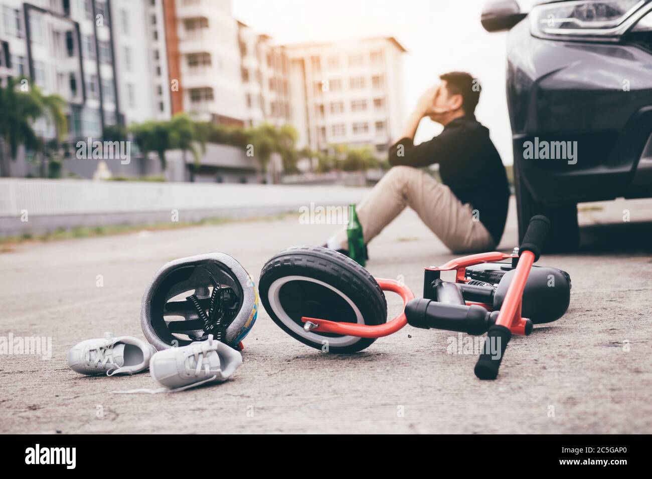 Man are stressed while being drunk with driving crash a child bike accident occurs. Stock Photo